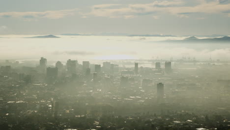 cape town city bowl enveloped by low cloud, high risers visible