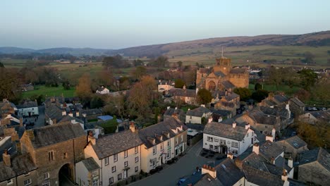 Aerial-footage-of-the-Medieval-village-of-Cartmel-in-the-English-Lake-District-it-has-a-rich-heritage,-and-varied-list-of-activities-for-visitors-and-tourists