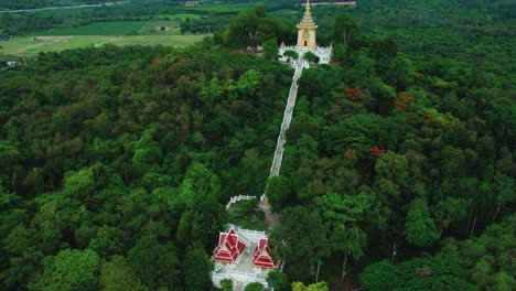 Aerial-view-on-asian-temple-on-a-hill-amongst-jungles