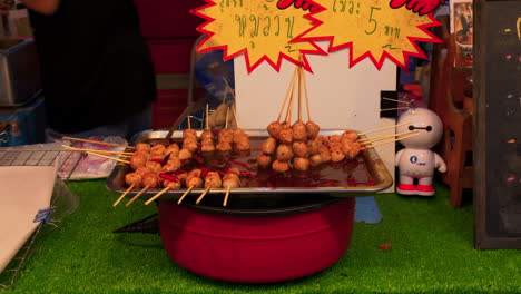 Streetvendor-selling-street-food,-a-local-food-market-in-Hat-Yai,-Thailand,-selling-tasty-spicy-meat