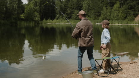 father and son fishing at the lake