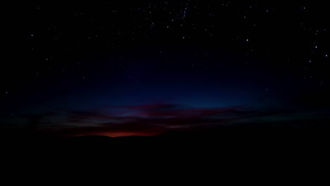timelapse red sunset over hills with starry sky
