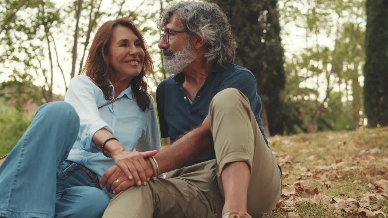 A loving mature couple enjoys a romantic moment outdoors