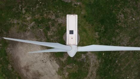 The-Eólico-Wind-Farm-in-Ortegal,-A-Coruña,-Spain,-Displays-a-Perspective-of-its-Blades-Rotating---Aerial-Topdown-Shot