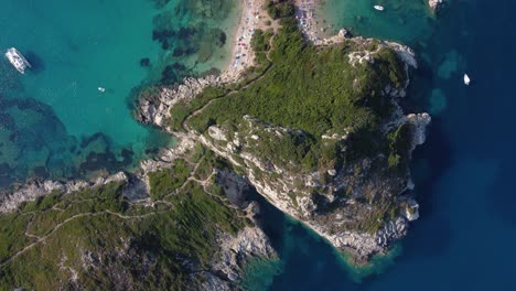 top view of overcrowded porto timone beach, corfu island, greece