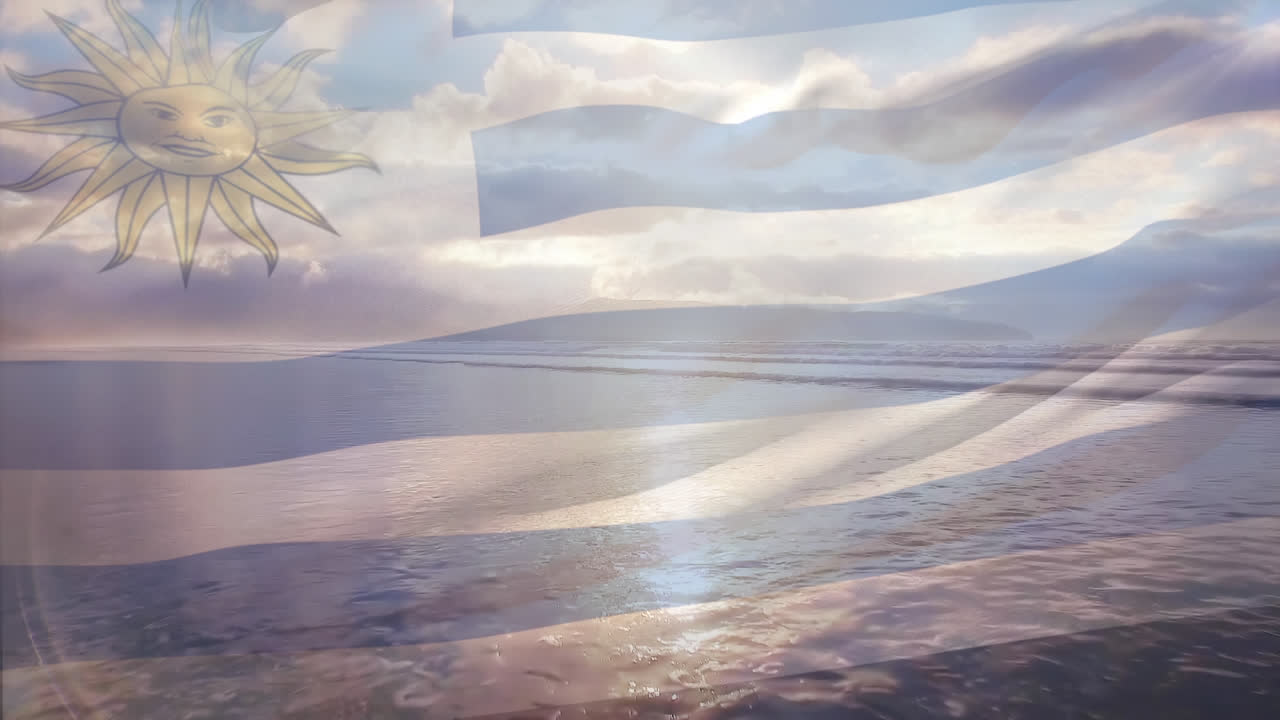 composición digital de la bandera uruguaya ondeando contra la vista aérea de la playa