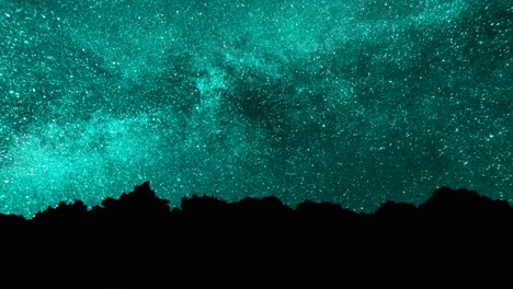 cielo nocturno turquesa con silueta de árboles