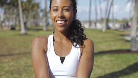 Contentwoman-stretching-hands-in-park