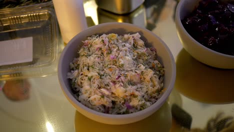 platter with coleslaw made from fermented white cabbage, carrots, and white radish