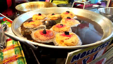 fried muffins in guatemala food stand