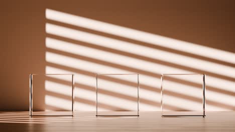 three clear glass display stands under sunlight