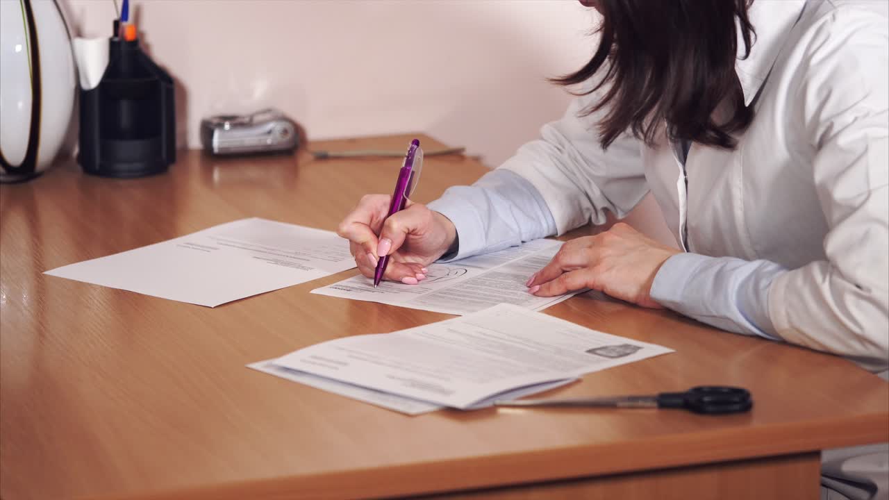 Doctor Filling Out Forms