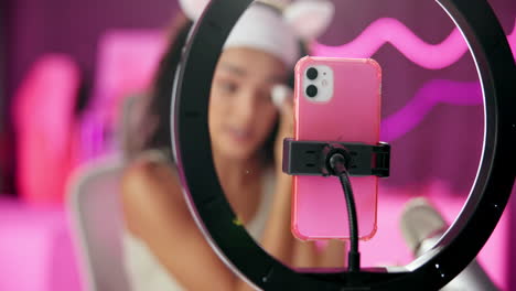 woman streaming with ring light and iphone