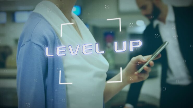 Animation of level up text over caucasian businesswoman using smartphone