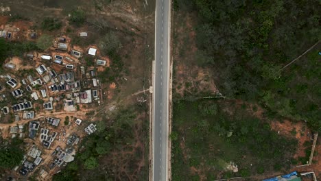 aerial view of a road passing through a cemetery