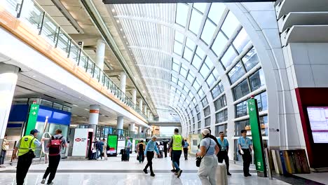 travelers and staff in bustling airport terminal