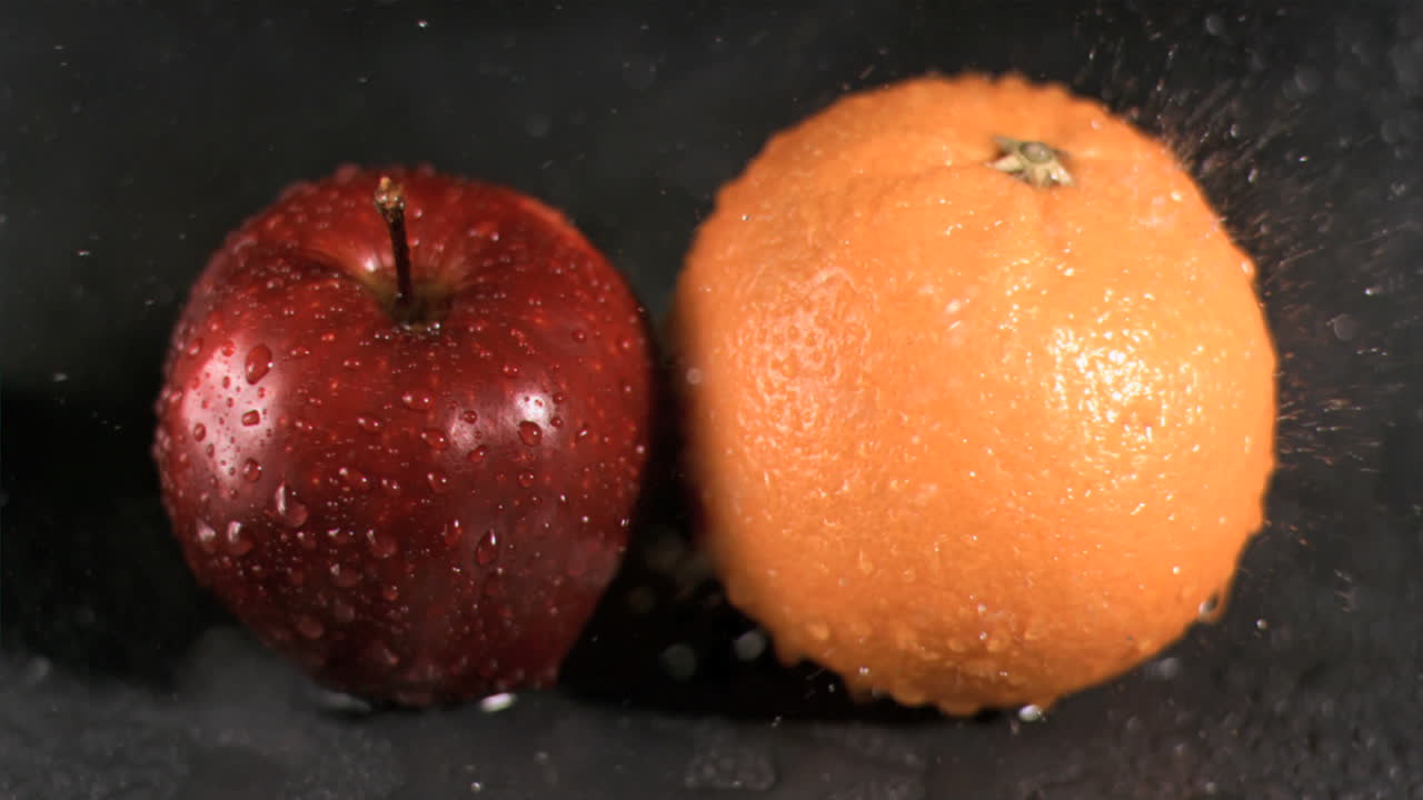 Water sprayed on fruits in super slow motion