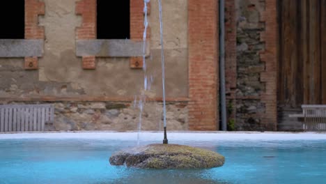 Revealing-shot,refreshing-water-graceful-arcs-from-nozzle-fountain