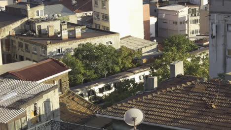 tram passing between slums in istanbul, highlighting contrasting urban scenes and cultures
