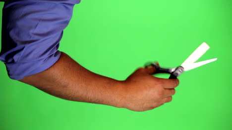 un brazo frente a una pantalla verde para ser tecleado y usado a voluntad
