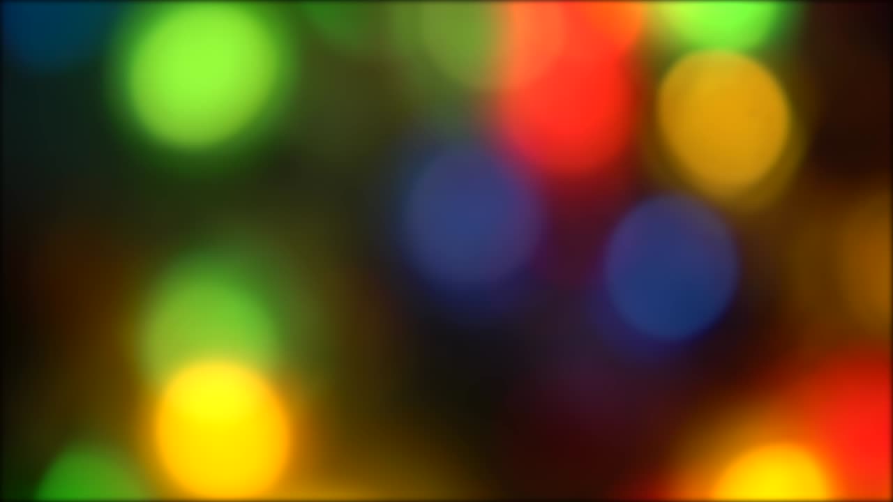 Abstract blurred festive colorful lights with bokeh background . Sparkling and twinkling bright . Blinking Christmas Tree lights circular rainbow color
