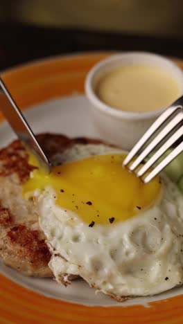 delicious chicken cutlet with sunny side up egg and sauce