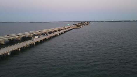 Aerial-view-of-fishing-pier-at-the-sunshine-skyway-bridge-where-fisherman-and-camping-take-place