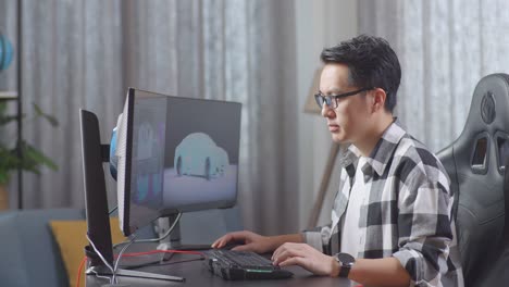 side view of asian male automotive designer working on 3d model of ev car on the desktop computers in the studio