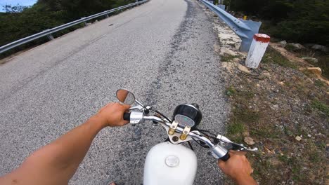 biker on shoulder of scenic road near banh chuoi starting journey. driver pov