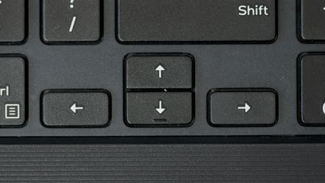 Finger-Pressing-Arrow-Keyboard-Buttons-Top-View