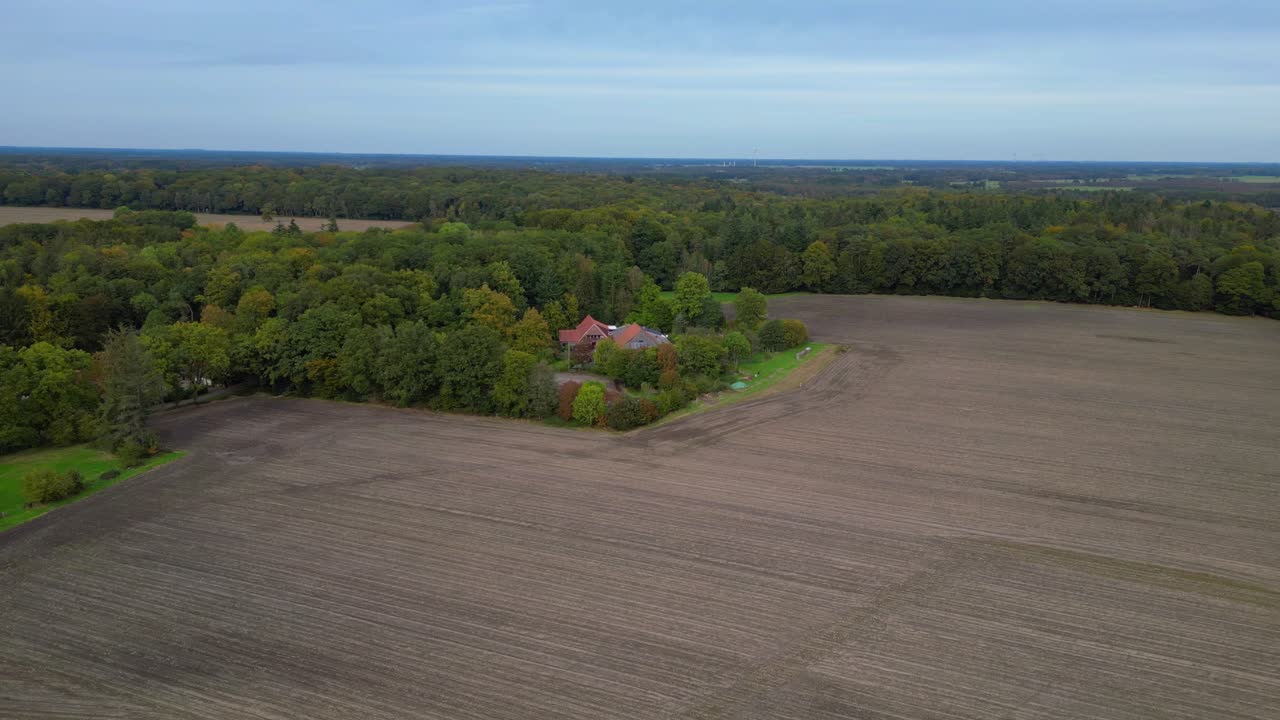 Aerial View of Farmhouse in Autumn Countryside