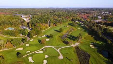 birds eye view over beautiful golf course amidst dense greenery at country club, cohasset, massachusetts