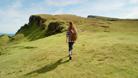 woman hiking in scottish highlands