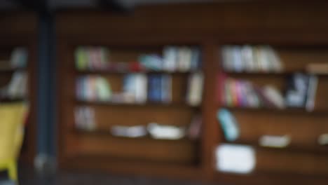 blurry image of a bookshelf filled with books