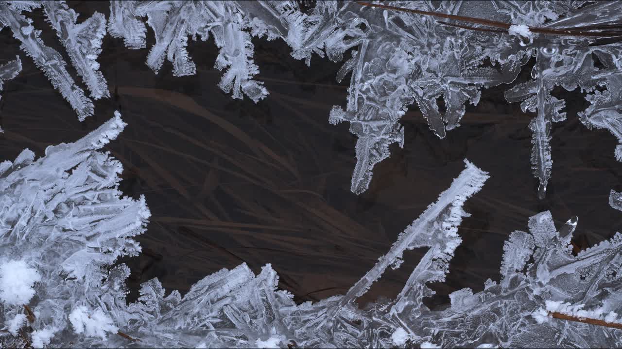 You can see beautiful ice crystals that have formed on a stream. The water flows between the ice layer in the cold winter. Winter wonderland