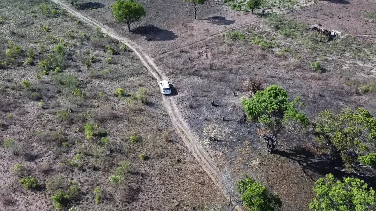 Drone follows white SUV in Remote Rural Mozambique