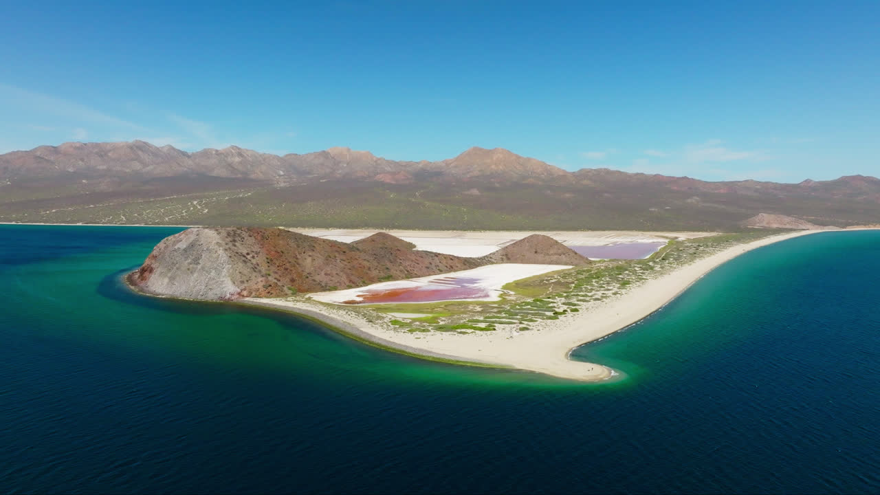 White Sandy Beach And Salt Lake In The Pristine Island Of San Jose In Baja California Sur, Mexico. wide aerial