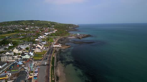 Aerial-shot-of-Whitehead,-a-seaside-village-in-Co