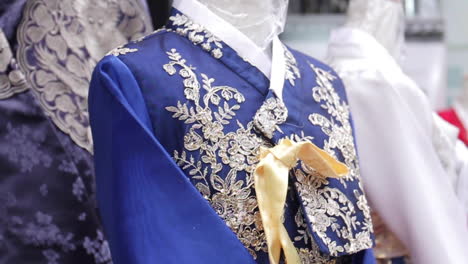 close-up of a blue embroidered korean hanbok