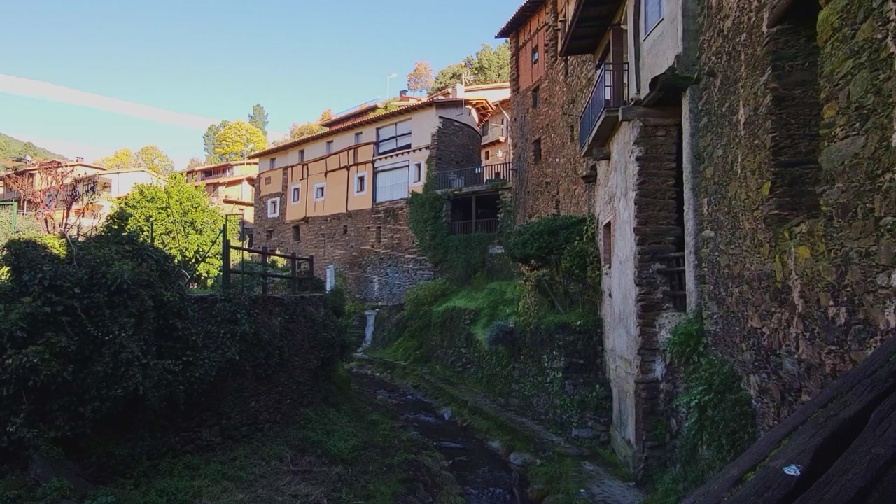 Robledillo de Gata. Cáceres. Spain. Panoramic view. Beautiful mountain village with stone and slate buildings. Waterfall next to picturesque stone and slate houses.