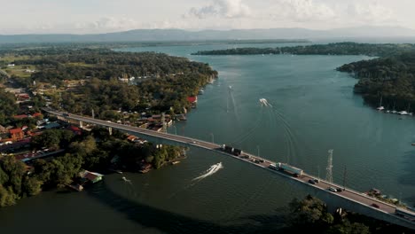 Traffic-Over-The-Longest-Bridge-At-Guatemala-In-Rio-Dulce,-Izabal