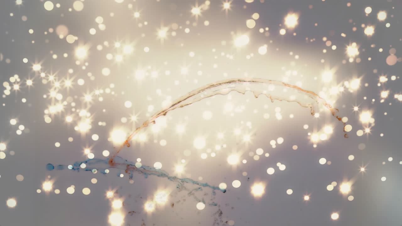 At start golden particles shining as teal and orange-red streams curving twisting for sleek motion