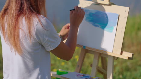 woman painting outdoors