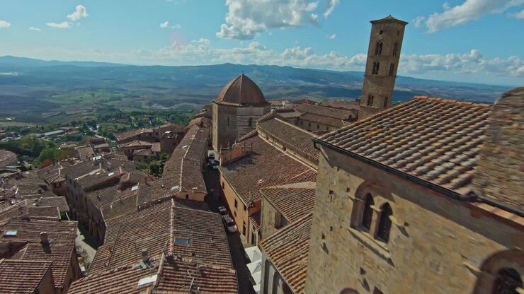 Fast aerial over the walled town of Volterra, Province of Pisa, Italy