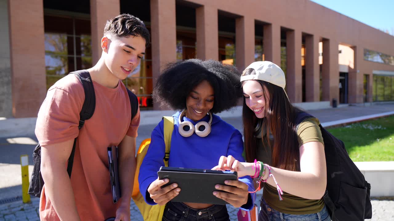 Diverse Students Collaborating and Learning with a Tablet on Campus