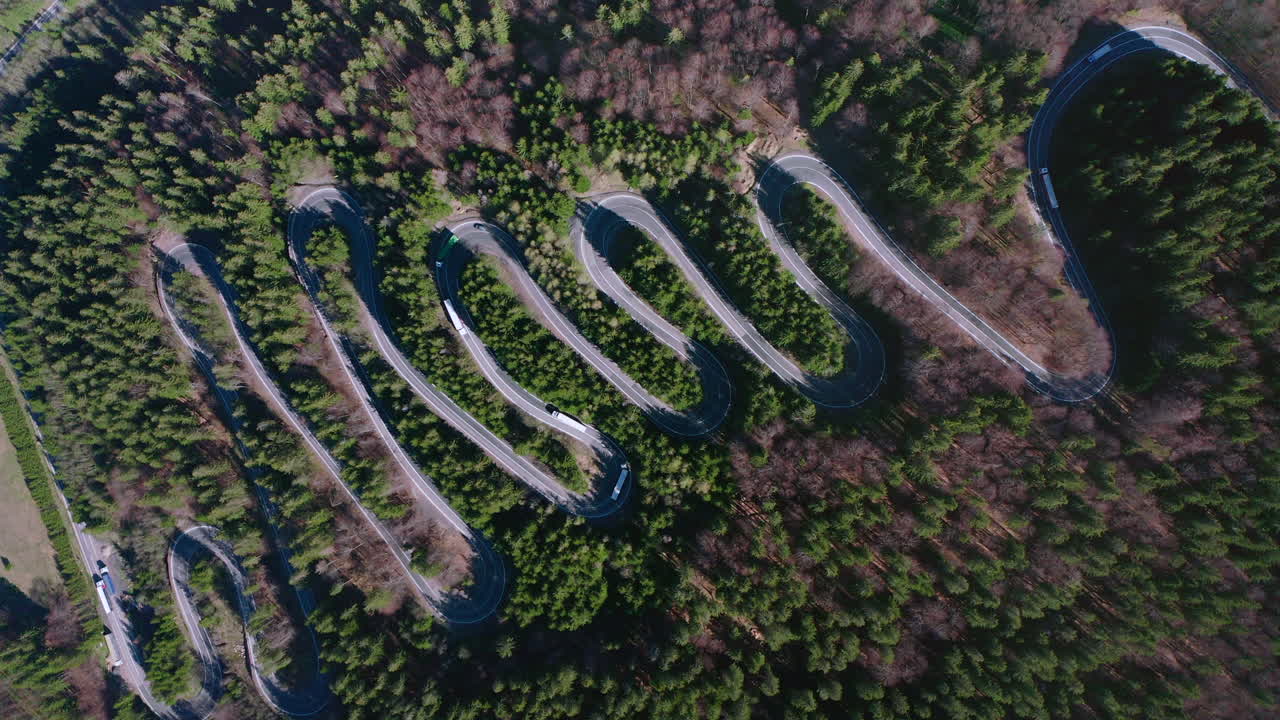 Vehicles Traveling The Meandering Road Of Bratocea Pass In Romania