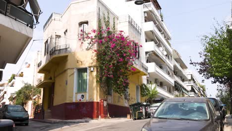 cars passing by a building in athens