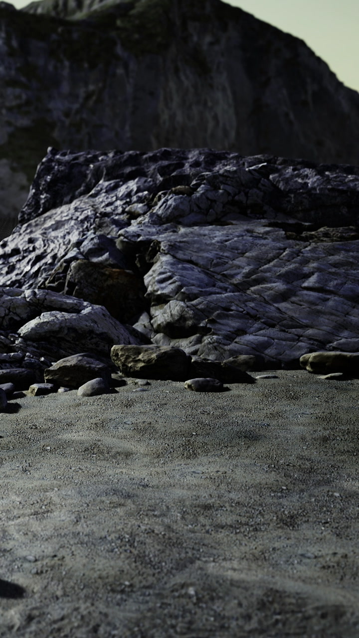 Rocks and gravel sit under a rocky surface in a natural setting near a wall