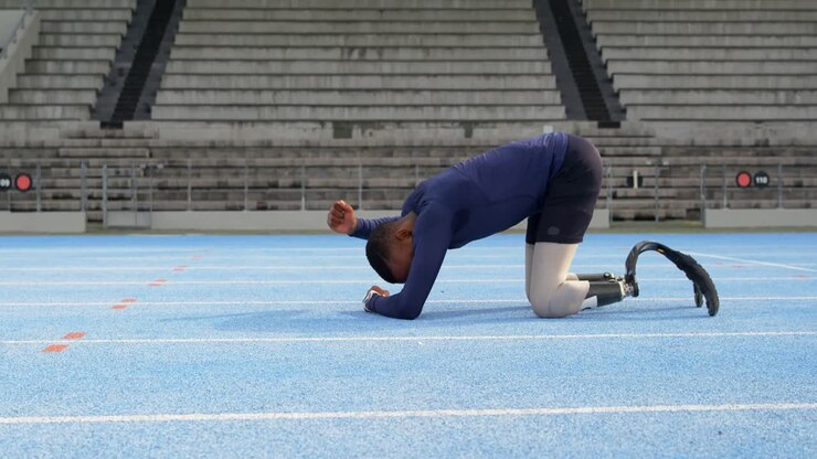 Disabled athletic relaxing on a running track 4k