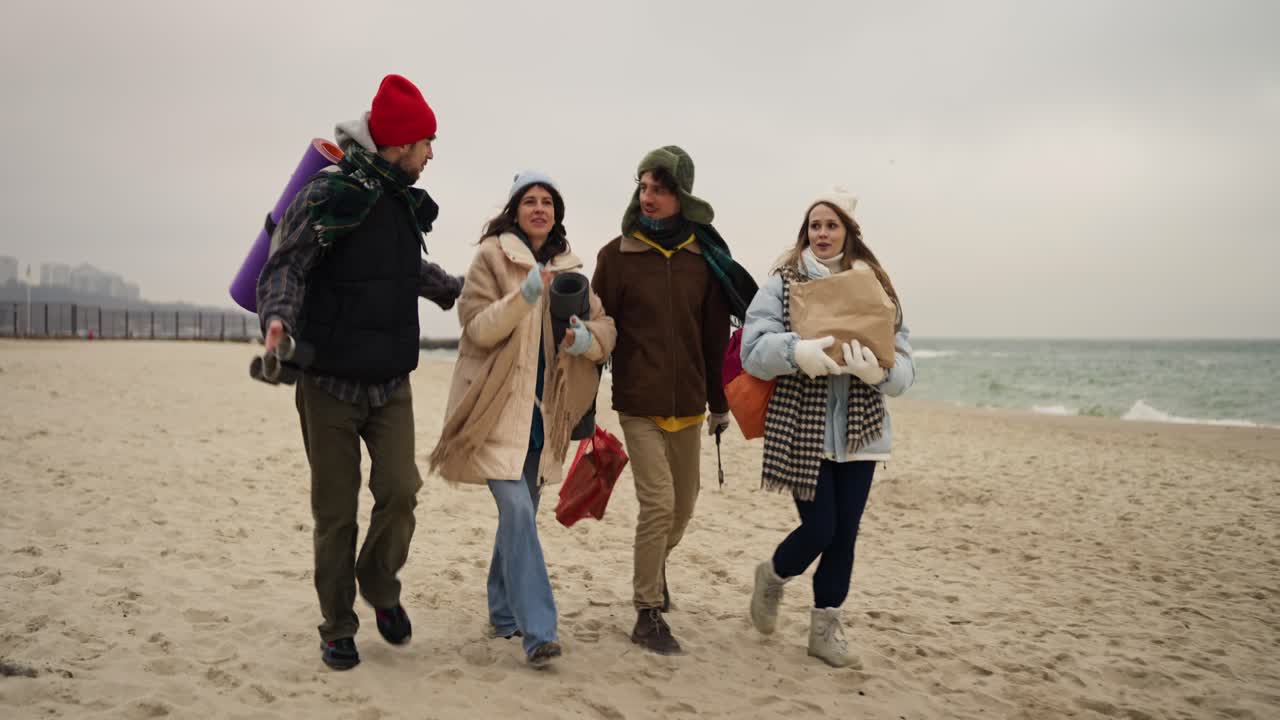 Friends Walking on the Beach in Winter